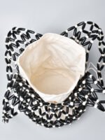 Artisan Cylindrical Woven Crossbody black + white beads bag